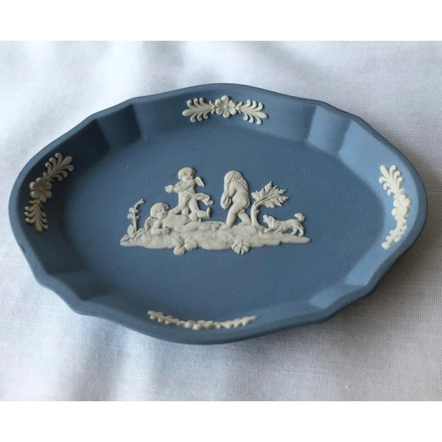 Classic Wedgwood blue jasperware trinket dish with its well known matte finish and white relief angelic figures, as well...