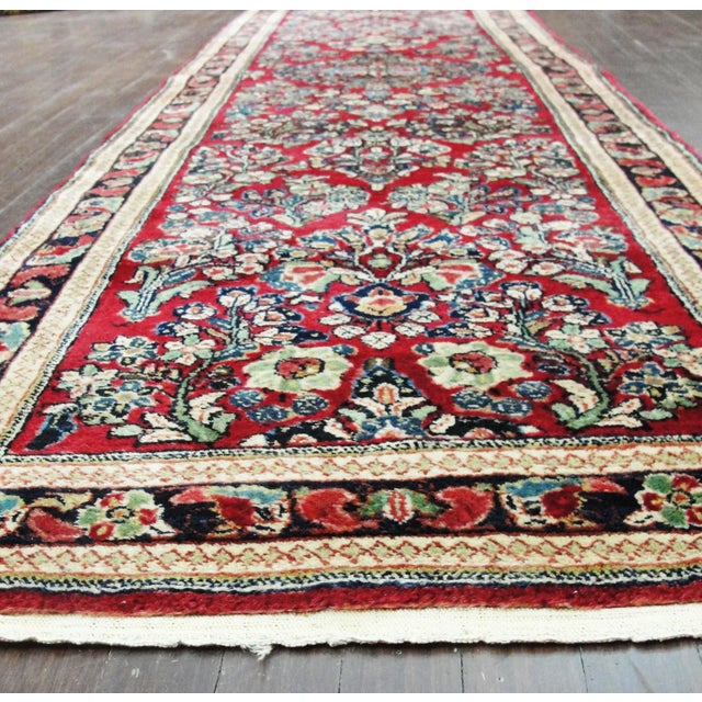 A handsome and finely woven antique Persian Sarouk runner dating to approximately 1930, preserved in excellent condition...