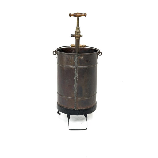 This sculptural handcrafted copper vessel from early 20th century Europe embodies the raw beauty of utilitarian industrial...