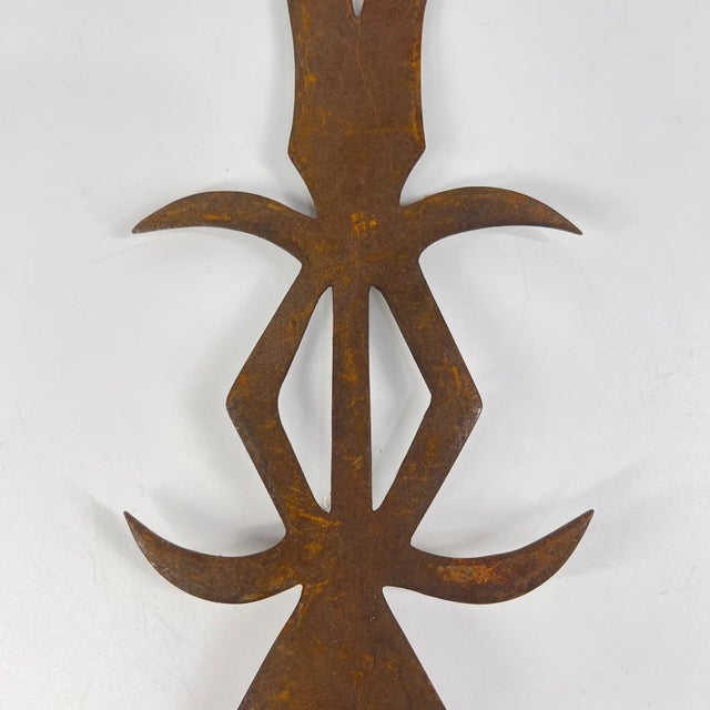The Ngombe Executionerâs Prestige Knife Currency from the Congo is a powerful and visually striking object that embodies...