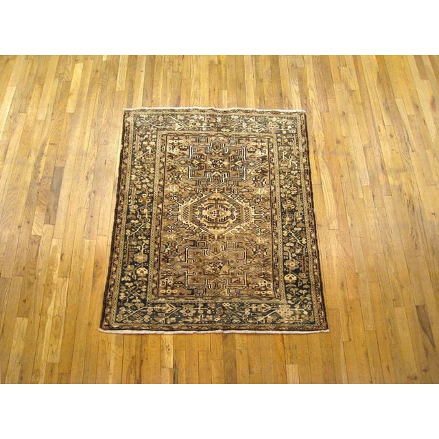 Vintage Persian Heriz Oriental rug, Small size A vintage Persian Heriz oriental rug, size 4'5" x 3'6", circa 1950. This...