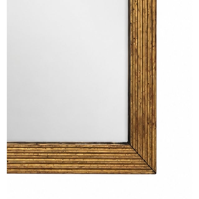 Large gold leafed mirror featuring a carved wood frame with an antiqued gold finish and mirror glass. Dimensions: 42" W x...