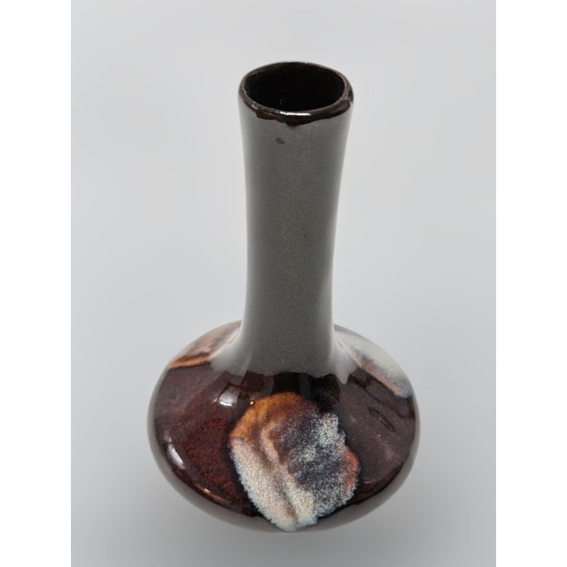 Capture the timeless elegance of Chinese ceramic artistry with this stunning Yao Bian oxblood flambé glaze vase. Dating...