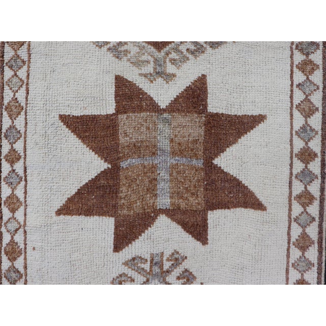 Measures: 3'4 x 12'1 Vintage Turkish Tulu Runner with Ivory Field and Muted Brown Star Motifs. Keivan Woven Arts / Rug...