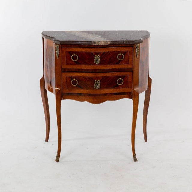 Small night dresser in style of Louis XV at the end of the 19th century. Two drawers with brass handles and fittings....