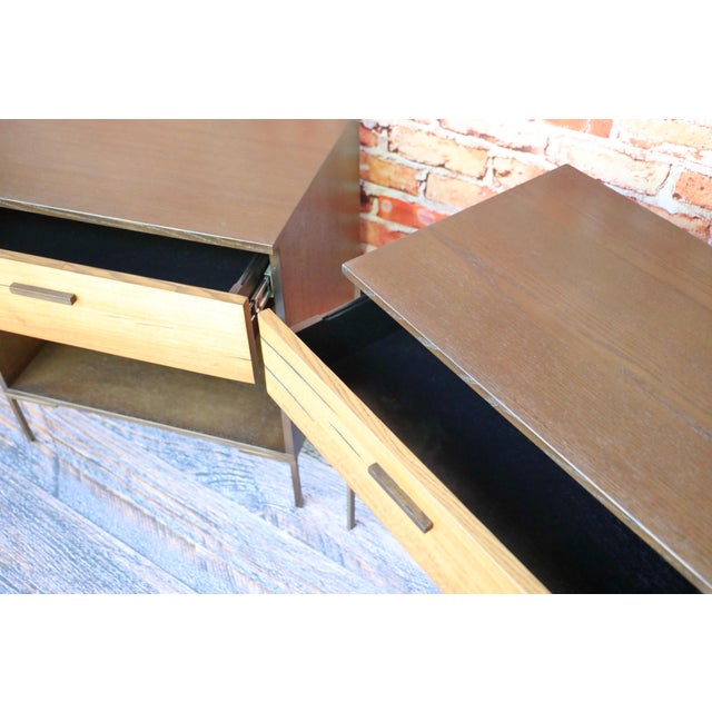 A matched pair of nightstands that bring genuine material interest to the bedside. Each features a single deep drawer clad...