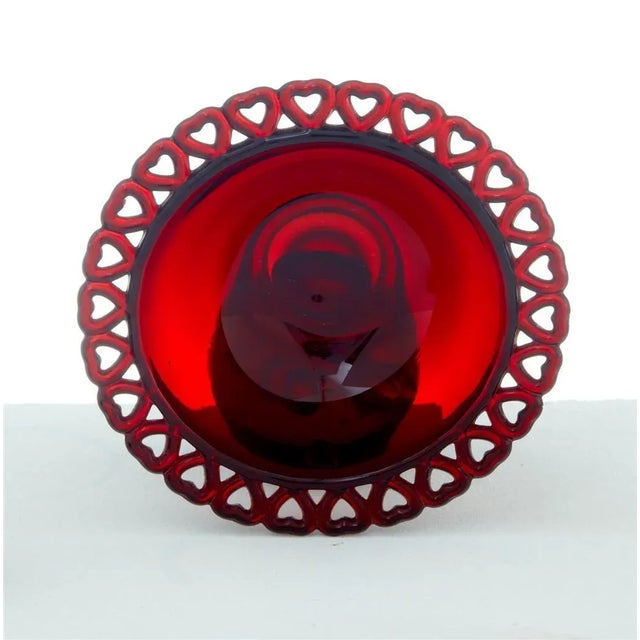 Set comprises of 1 heart design bowl, a paperweight and a pair of salts. Small chip to base of paperweight. Height1.5...