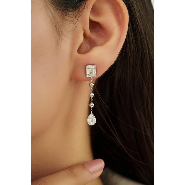 These elegant drop earrings feature 1.08 carats of mixed-cut diamonds set in 14K white gold. The diamonds are set in...