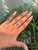 This striking 1.06 carat emerald-cut emerald and diamond split-shank ring is crafted in 14K yellow gold. The emerald...