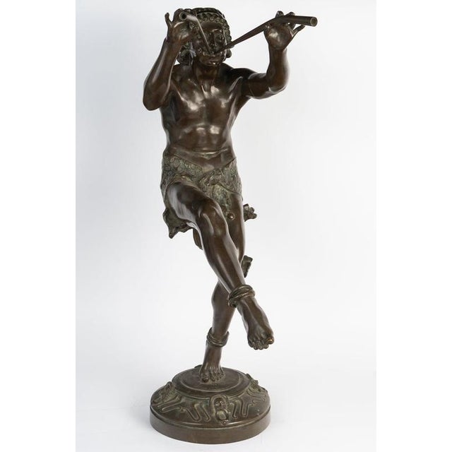 Large bronze sculpture by e. Piron, *the piper*, in patinated bronze, circa 1900. Patinated bronze sculpture depicting a...