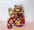 A striking pair of vintage Japanese Kutani-yaki guardian lion figurines, commonly known as Foo Dogs or Fu Lions, dating to...