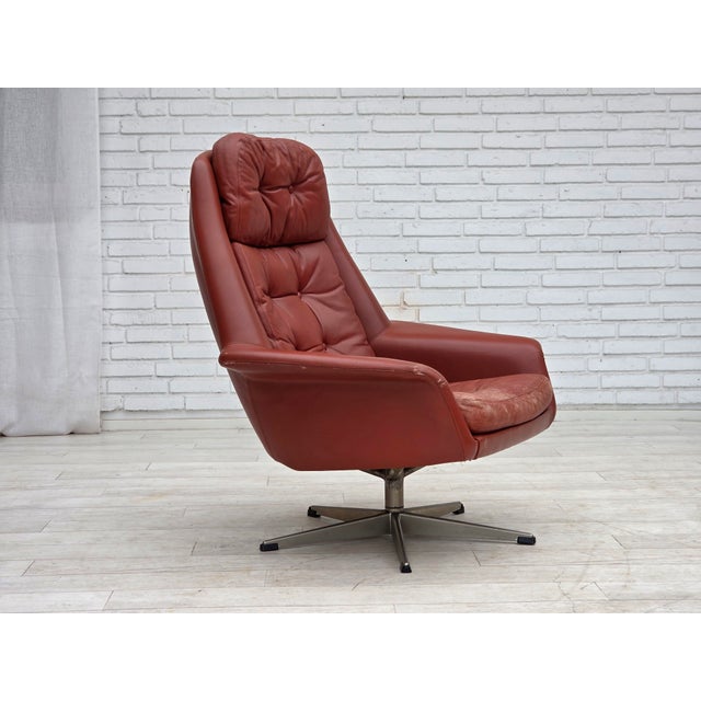 1970s, Danish design by H.W.Klein, swivel armchair. Original light brown furniture leather, five fingers steel base....