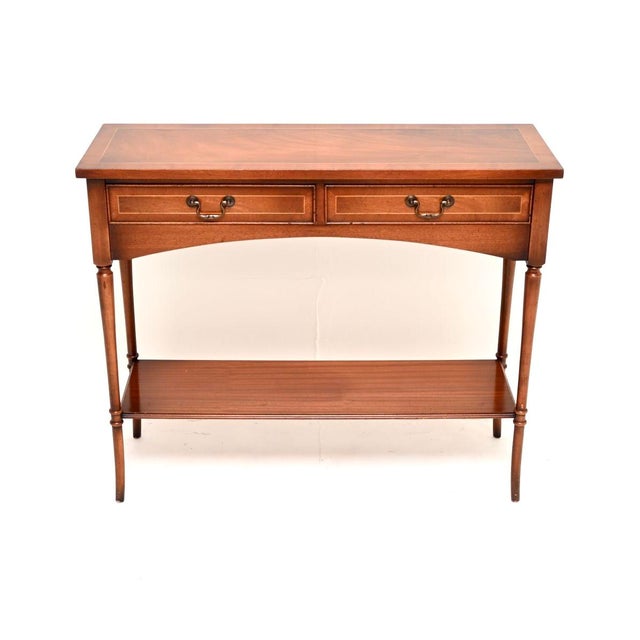 A smart and very well made antique inlaid console table. This was made in England, it dates from around the 1950’s. It is...