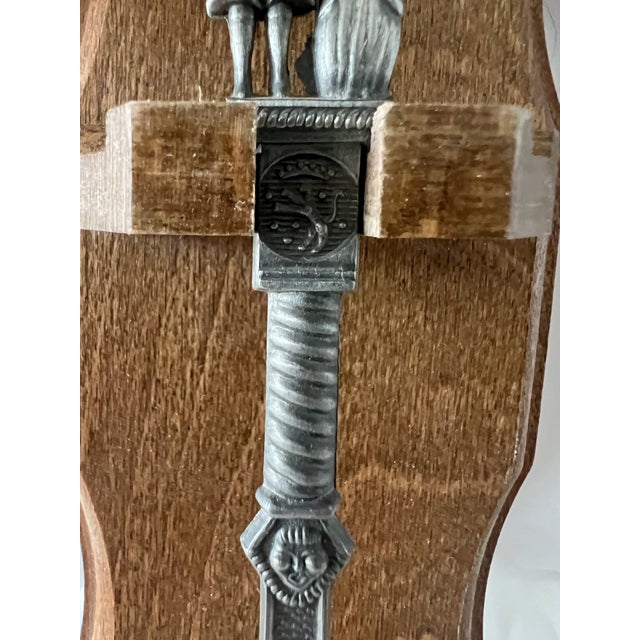 King Henry III and Queen Mary adorn the top of the Dutch spoon. The spoon is made of pewter and the holder is made of...