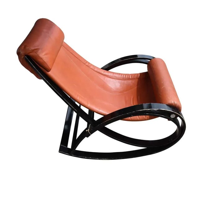 “Sgarsul” rocking chair,leather upholstered on a black lacquered bent wood structure designed by Gae Aulenti for...