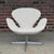 Beautiful 1960s Swan chair designed by Arne Jacobsen for Fritz Hansen with a brushed aluminum swiveling four-star base and...