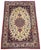 A beautiful vintage Isfahan rug handwoven circa 1940 with a concentric medallion on an ivory field and secondary colours...