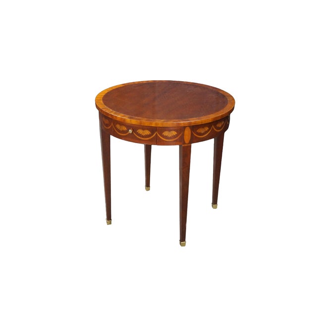 Mid-to-late 20th-century Baker Furniture Federal style mahogany accent table showcasing an exquisite array of traditional...