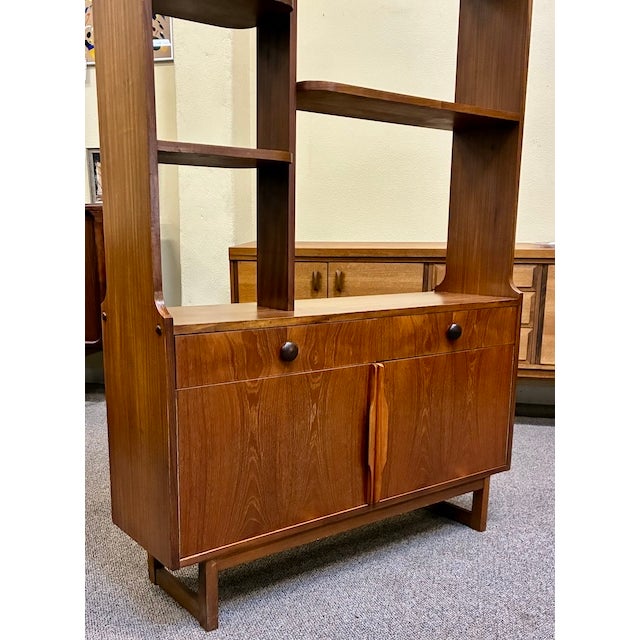 Teak Room Divider or wall unit by Stonehill Cabinet Maker. Import from U.K. Sleek shelving and Drawers with sliding door...