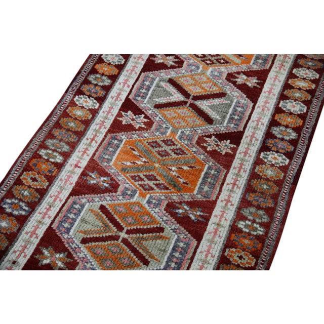 Introducing a one-of-a-kind vintage Turkish hand-knotted wool rug, carefully crafted by skilled artisans using traditional...