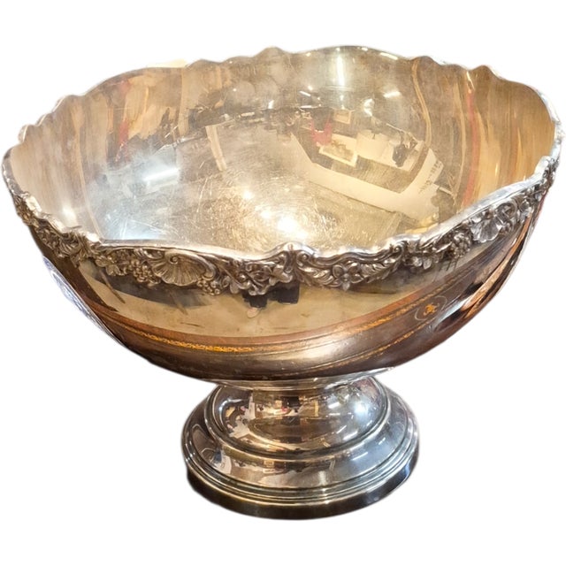 A vintage silver over copper punch bowl and wine cooler. It measures 14 inches dia by 11 inches tall.