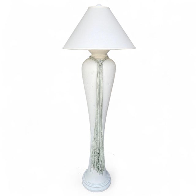 Add an effortlessly elegant, coastal-inspired statement to your space with this tall vintage floor lamp. Featuring a...