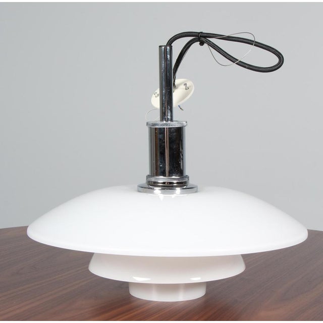 Poul Henningsen pendant lamp in chrome and opal glass. Model 4½/4, made by Louis Poulsen. This piece is attributed to the...
