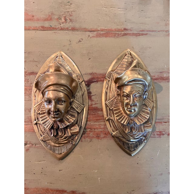 Striking pair of vintage H. Vankruck cast brass wall pockets, featuring highly dimensional theatrical Pierrot or jester...