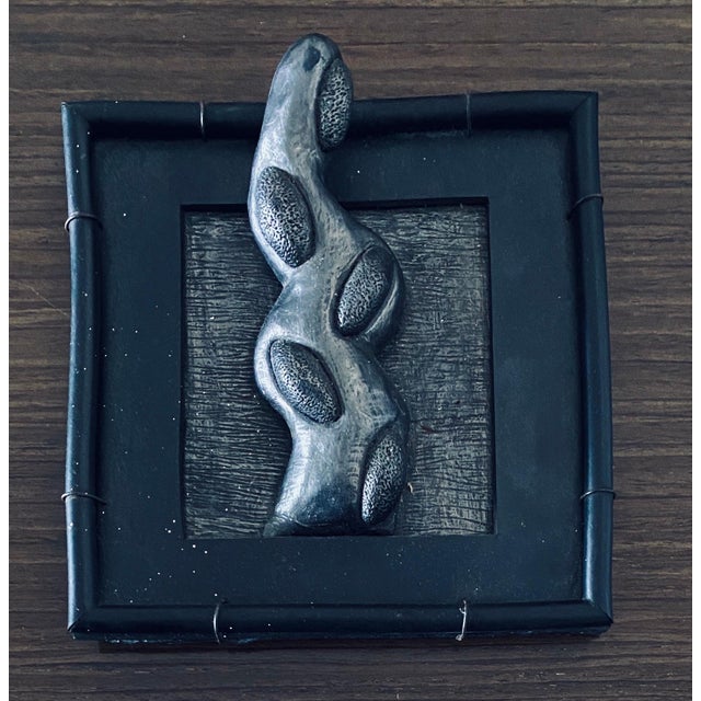 This is a wall sculpture of a protruding abstract organic appendage form. They are in the form of Surrealist fantastic...