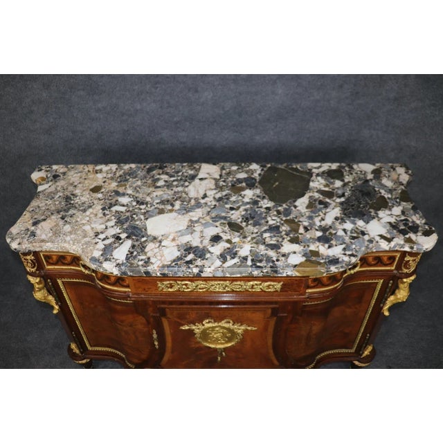 An exceptional early 20th-century French sideboard in the Louis XVI/Directoire style, this commode is a masterclass in...