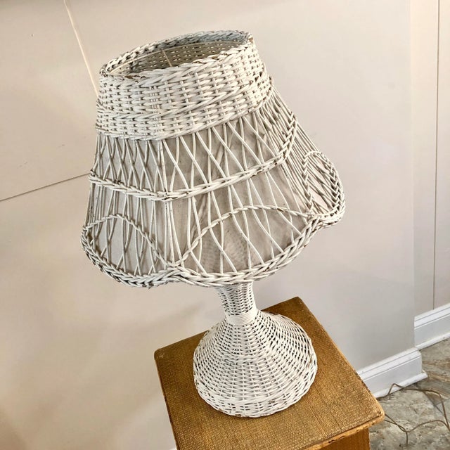 Early 20th century white wicker table lamp.