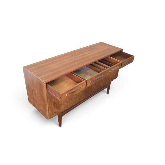 This "Fresco" credenza was designed by Victor B. Wilkins and produced by G Plan in England in 1966. The case combines teak...