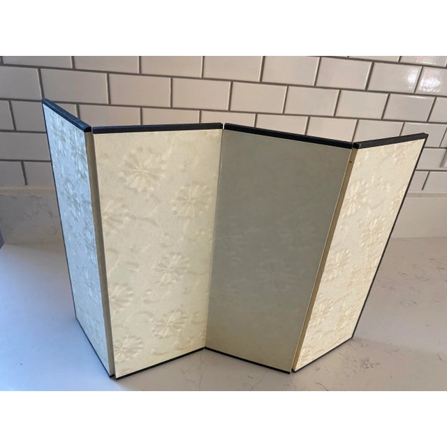 A lovely vintage Byobu folding screen, with a gold color on one side and a textured pattern on the other. This screen...