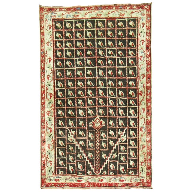 A one of a kind antique Turkish Ghiordes scatter size rug from the early 20th century. Measures: 3'7'' x 5'4''.