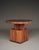 A very stylish Art Deco coffee table or side table from the 1930s. It has a circular top on a cubist, geometric base...