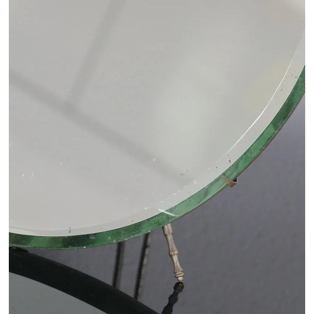 Round table mirror by Luigi Fontana & C from the Italian 1950s. This piece has an attribution mark, I am sure that it is...