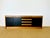 Vintage Scandinavian sideboard dating from the 1970s, featuring three storage doors with shelves and four drawers. Doors...