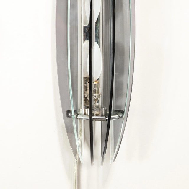 This pair of Mid-Century Modernist Smoked Glass Sconces are fabricated by VECA, originating from Italy, Circa 1970....