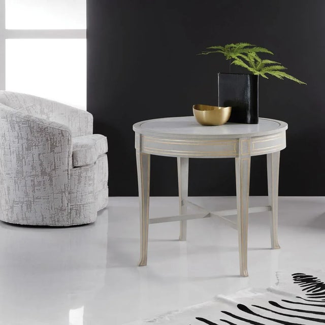 Our Painted Round Side Table showcases unparalleled attention to detail. The inset polished Cararra white marble top...