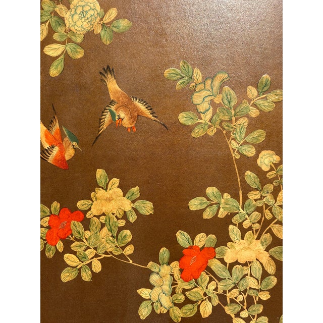 A beautifully composed antique Chinese four-panel folding screen, featuring hand-painted silk wallpaper from the Qing...