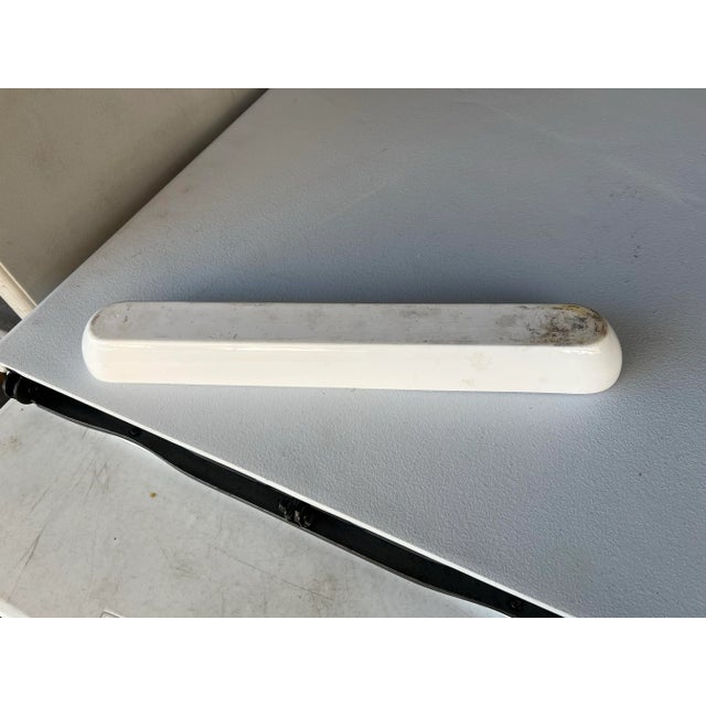 Long ceramic serving boat. This would look great on a table . You could bake a long and narrow loaf of bread. Serve Sushi...