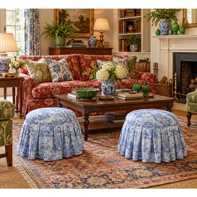 Optimized Description Beautifully crafted pair of round storage ottomans upholstered in a classic blue-and-ivory pastoral...