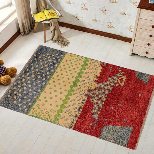 This stunning hand-knotted Afghan Balouchi rug is a captivating addition to any decor. Crafted by skilled artisans, it...