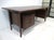 An exceptionally stunning Brazilian rosewood executive desk with floating top, three drawers to each side and to the...