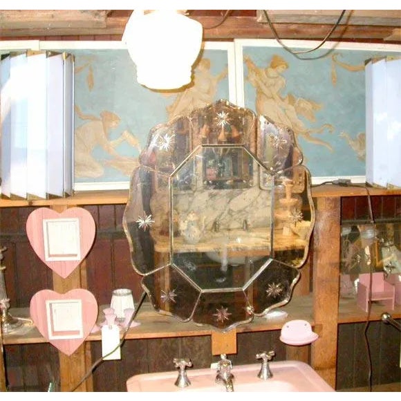 A pair of articulating brass arm wall lamps with pale blue Lucite slatted cylindrical shades.