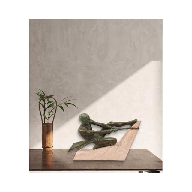 Antique Sculpture, 1930s, shows a Warrior pulling a rope with strength and power. The work proposed here is in Antimony...