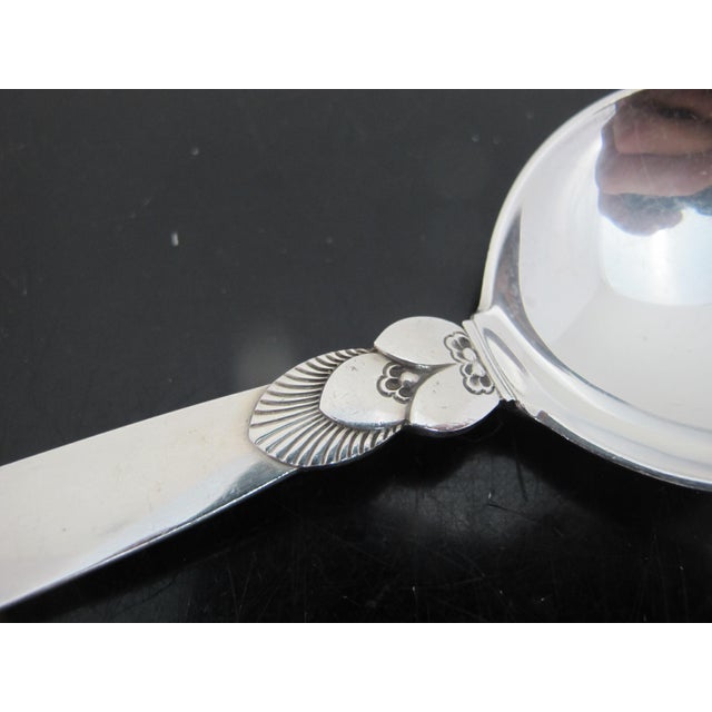 Georg Jensen sterling soup or cream spoon in Cactus design. Measures approximate 6 1/4". Weighs 52.6 grams. In excellent...