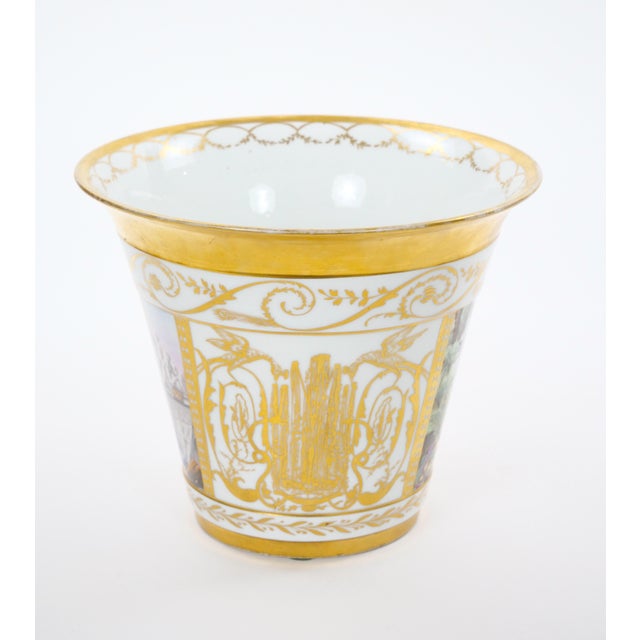 This elegant pair of 19th-century French porcelain cache-pots beautifully reflects the refined craftsmanship and...