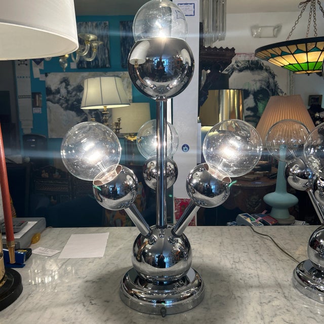 Fantastic pair of period chrome atomic tabletop lamps. Each lamp has 4 arms with sockets and they come with the clear...