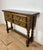 Striking Spanish Renaissance Revival console or writing table, crafted in oak and dating to the early 20th century. The...